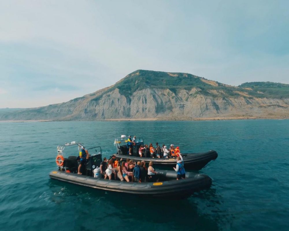 Group enjoying RIB boat adventure on the Jurassic Coast from West Bay
